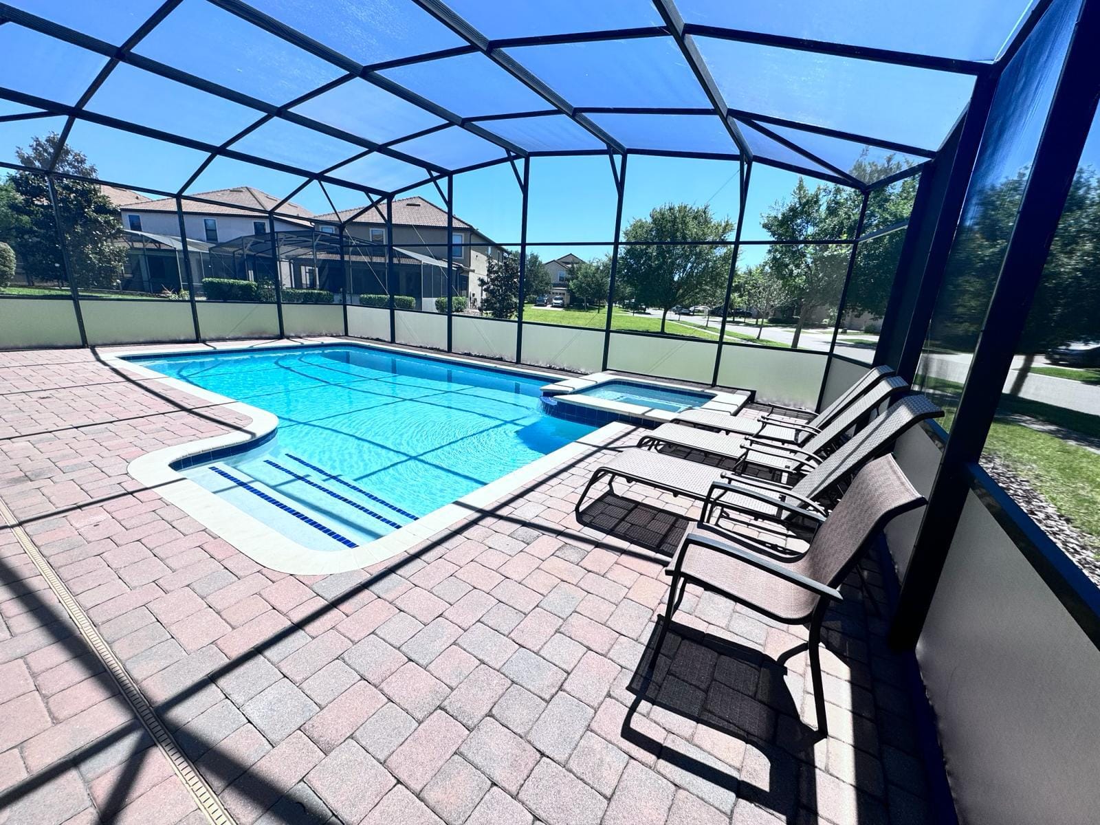 Screened private pool and spa at a Champions Gate vacation rental home
